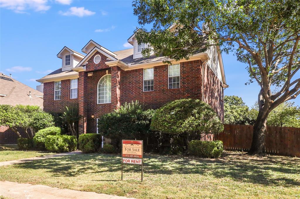 8100 Steamers Lane Frisco, TX 75035 - Photo 2 of 24 a front view of a house with a yard garage and outdoor seating