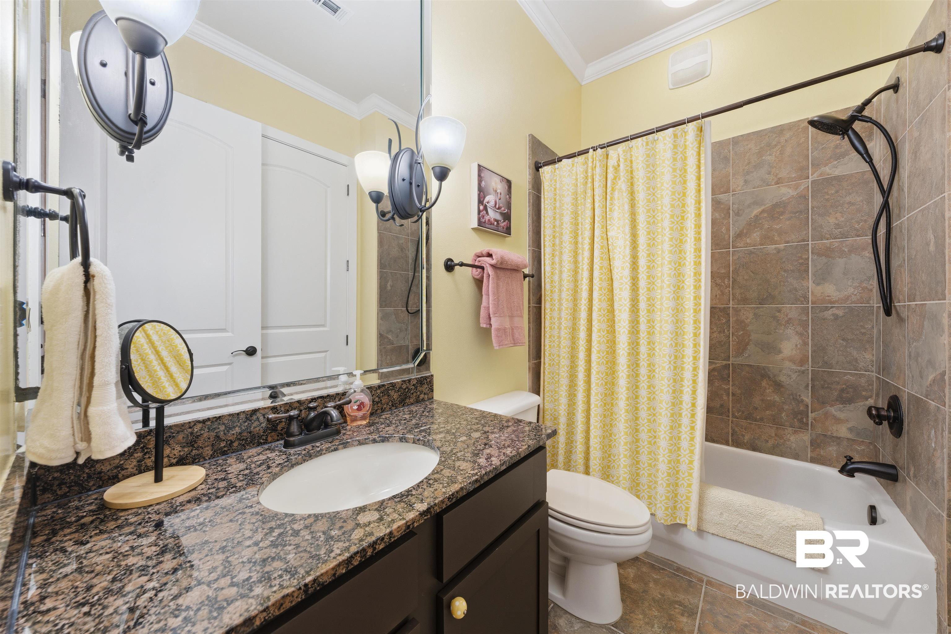 1430 Regency Road, Unit H202 Gulf Shores, AL 36542 - Photo 5 of 25 Full bathroom featuring shower / bathtub combination with curtain, vanity, and crown molding