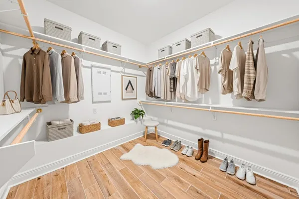a bathroom with a tub sink and a mirror