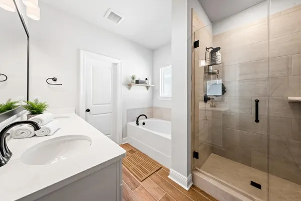 a bathroom with a sink and shower