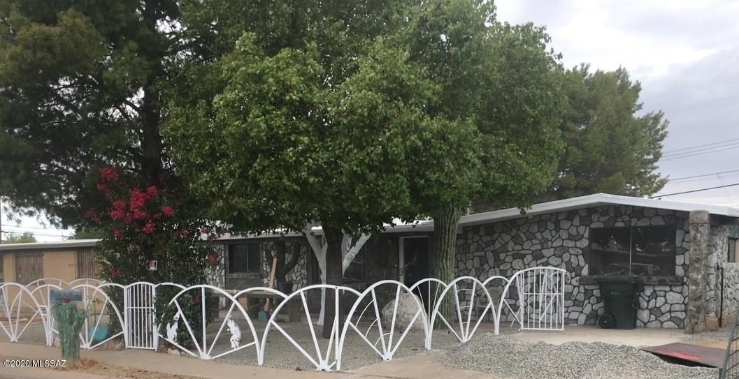 1454 West Roger Road Tucson, AZ 85705 - Photo 20 of 20 a couple of bicycles parked next to a building