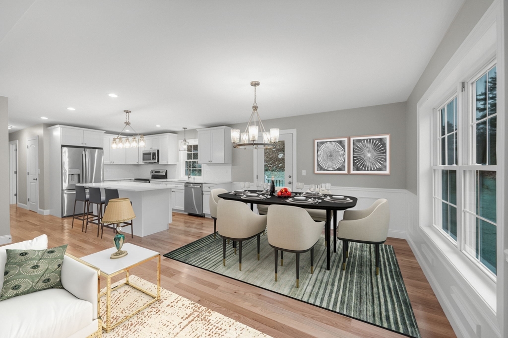 6 High Blf Road Belchertown, MA 01007 - Photo 11 of 42 a view of a dining room with furniture and wooden floor