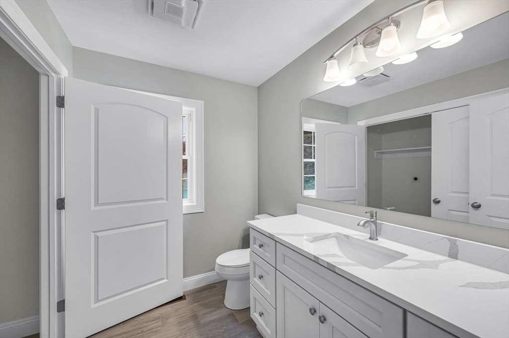 6 High Blf Road Belchertown, MA 01007 - Photo 21 of 42 a bathroom with a toilet a sink a mirror and a shower