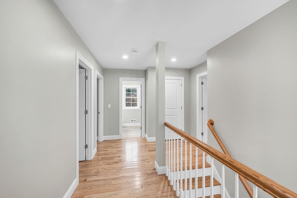 6 High Blf Road Belchertown, MA 01007 - Photo 22 of 42 a view of a hallway with wooden floor and staircase
