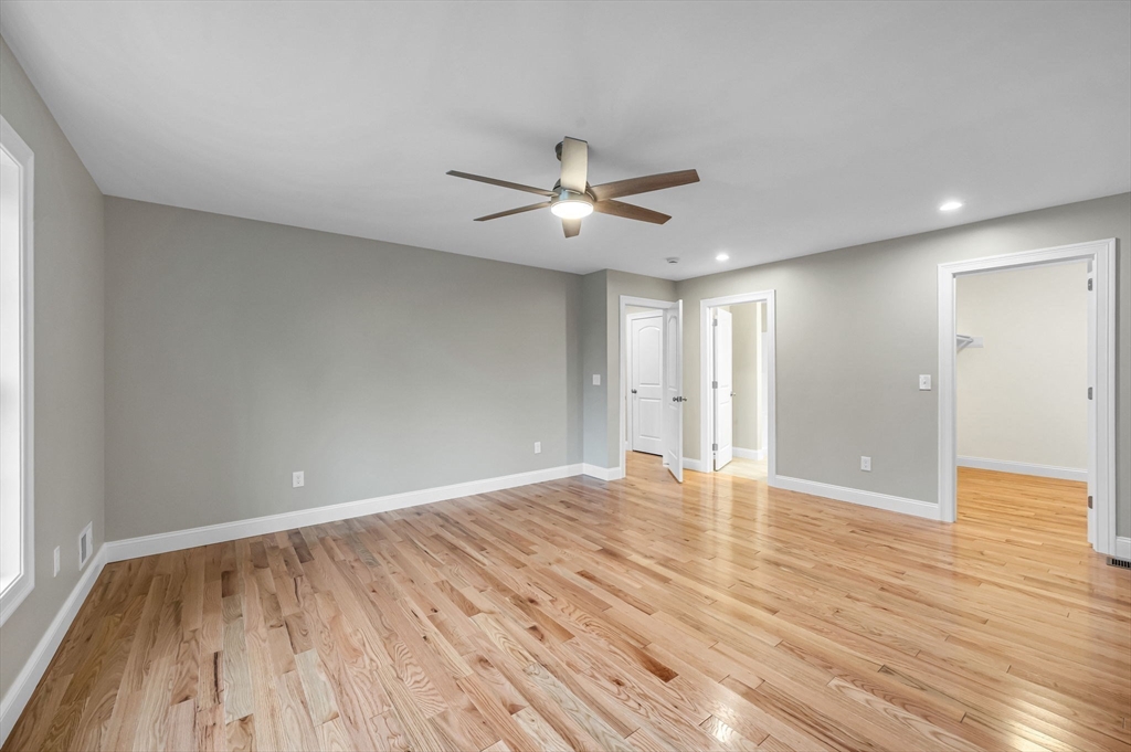 6 High Blf Road Belchertown, MA 01007 - Photo 25 of 42 a view of empty room with wooden floor and fan