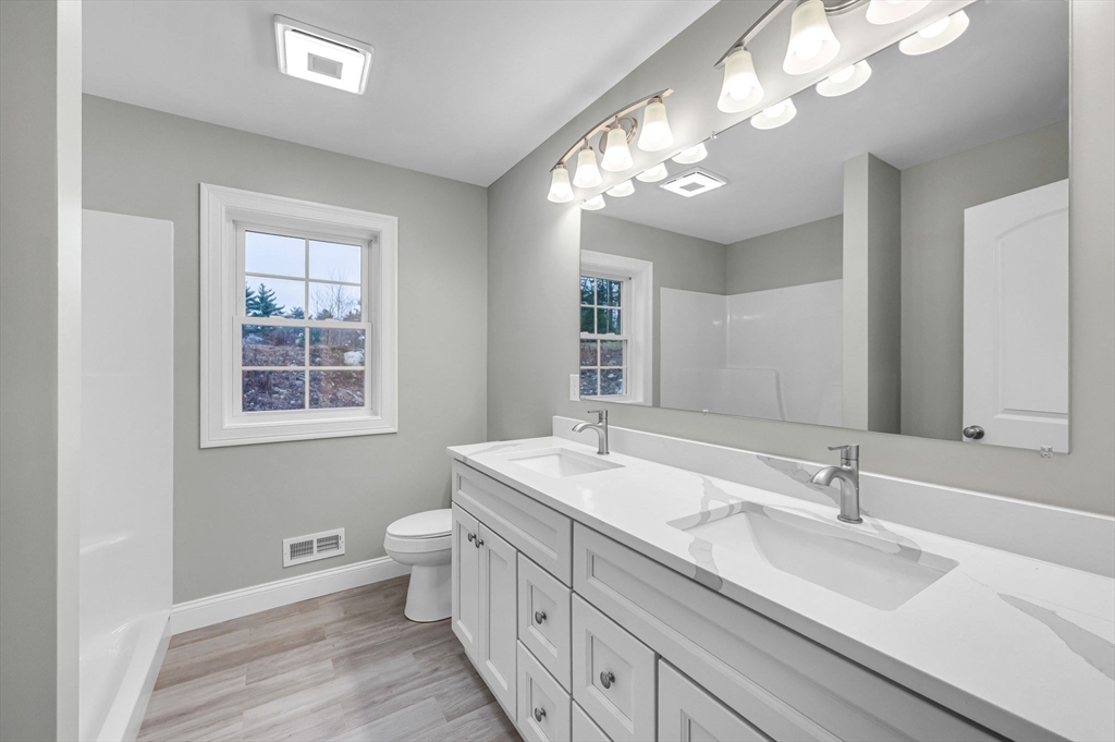 6 High Blf Road Belchertown, MA 01007 - Photo 27 of 42 a bathroom with a sink a toilet and a mirror