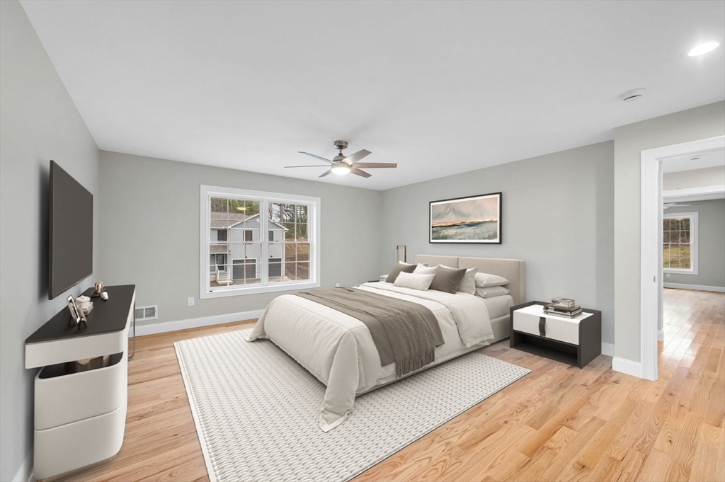 6 High Blf Road Belchertown, MA 01007 - Photo 28 of 42 a bedroom with a bed and wooden floor