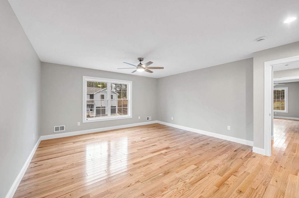 6 High Blf Road Belchertown, MA 01007 - Photo 29 of 42 a view of an empty room with wooden floor and a window