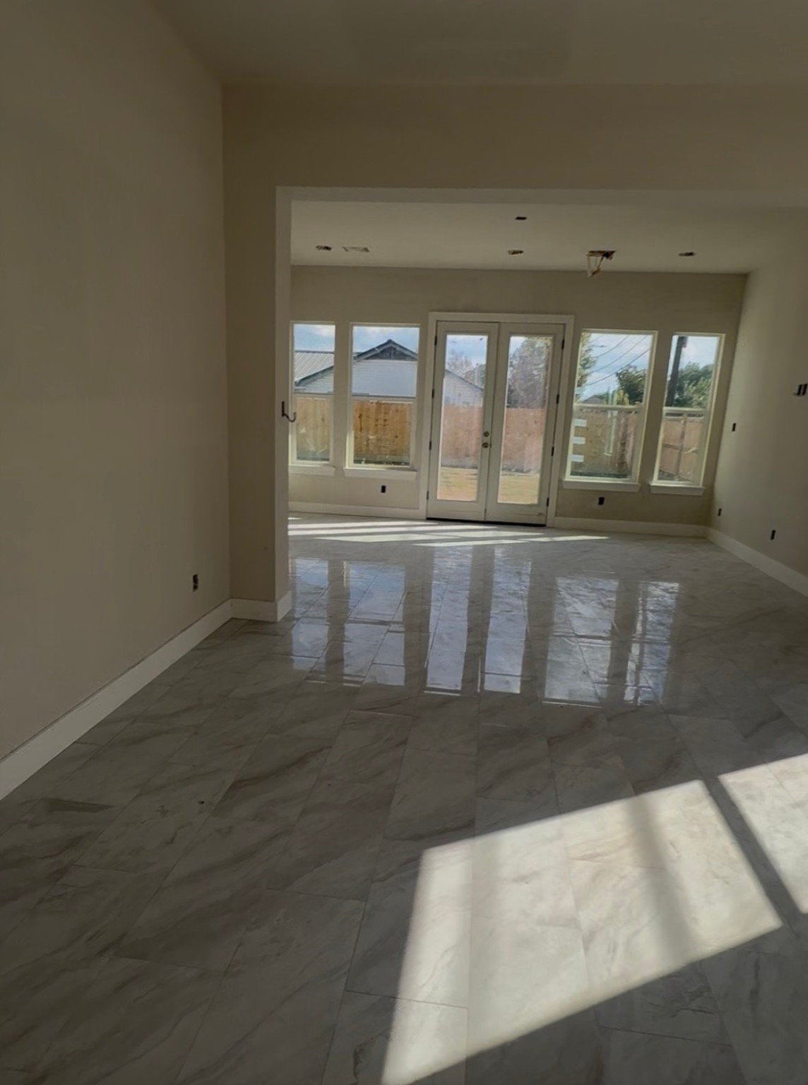6808 Ralston Street, Unit A Houston, TX 77016 - Photo 2 of 7 wooden floor in an empty room with a window