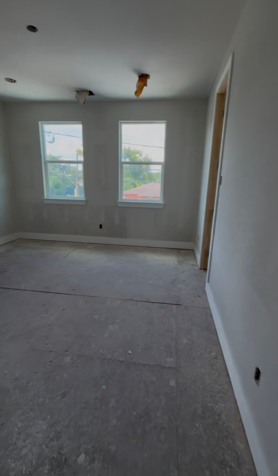 6808 Ralston Street, Unit A Houston, TX 77016 - Photo 4 of 7 an empty room with windows