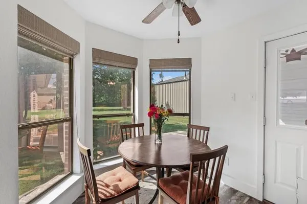 a dining room with furniture and window