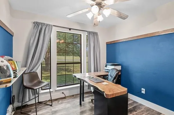 a view of a livingroom with furniture and window