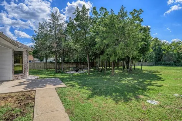 a view of a park with large trees