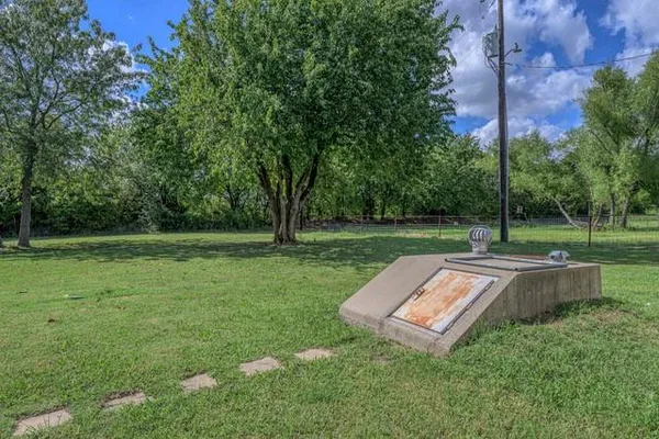 a view of a park with large trees