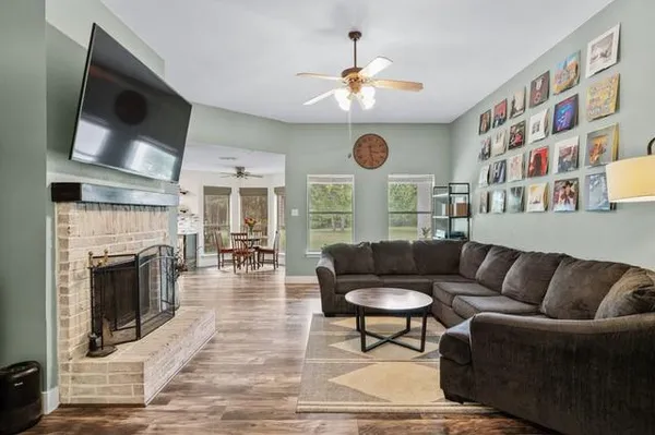 a living room with furniture and a fireplace