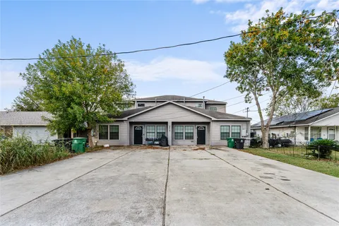 a house with trees in the background