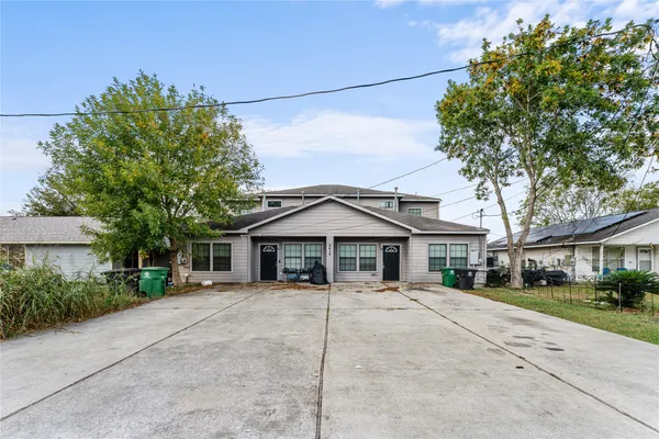 a house with trees in the background