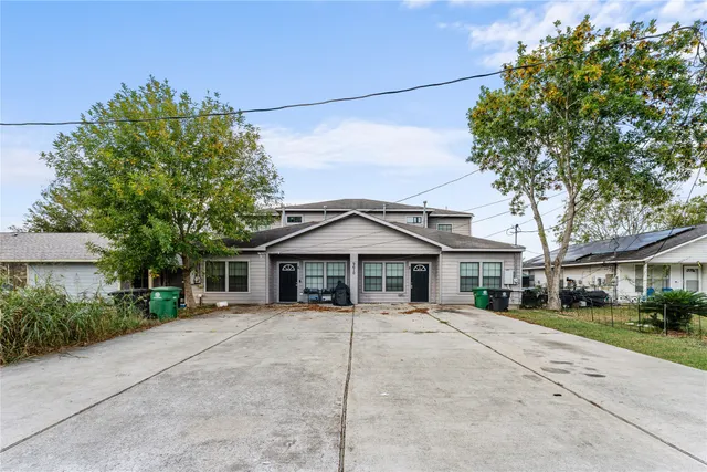 a house with trees in the background
