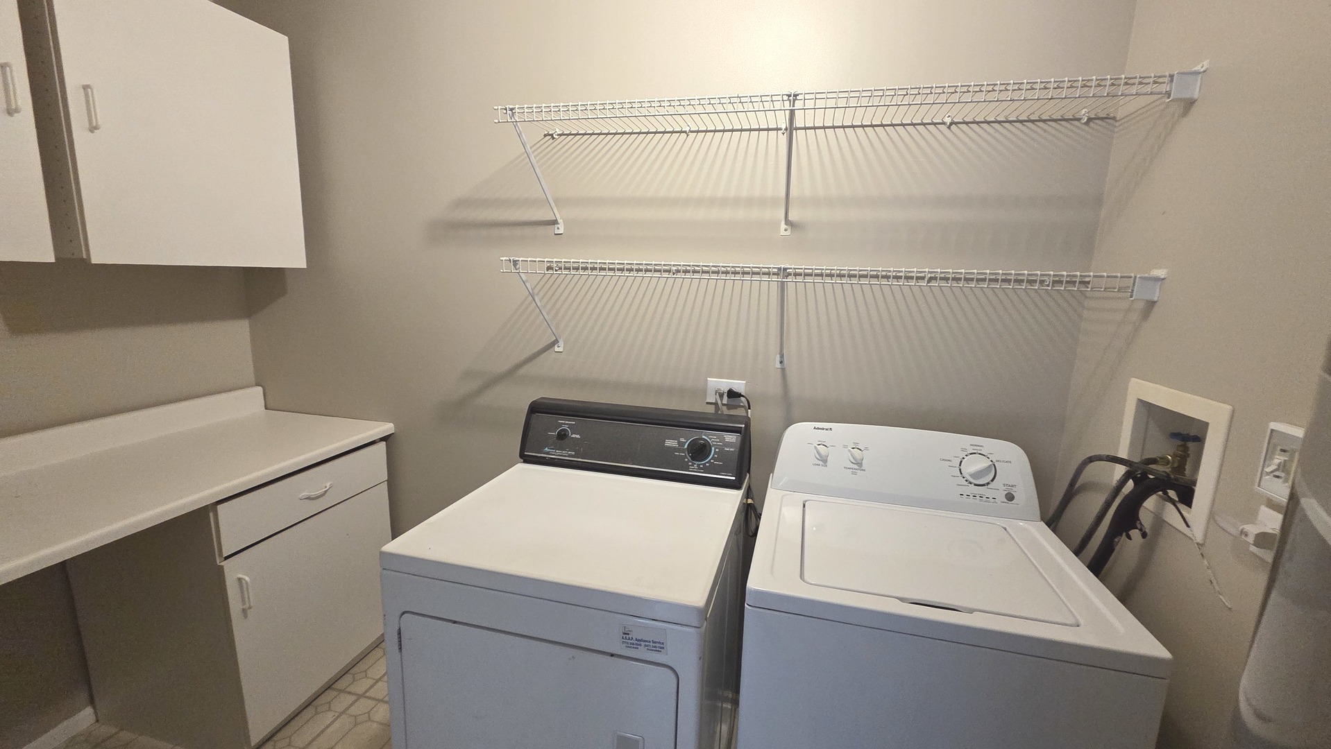 67 Beechmont Court, Unit W2 Schaumburg, IL 60193 - Photo 13 of 15 a utility room with dryer and washer