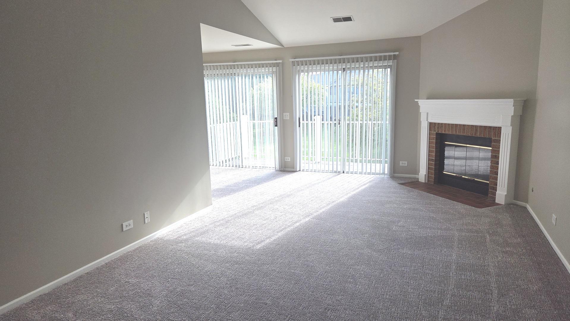 67 Beechmont Court, Unit W2 Schaumburg, IL 60193 - Photo 3 of 15 a view of a livingroom with a fireplace