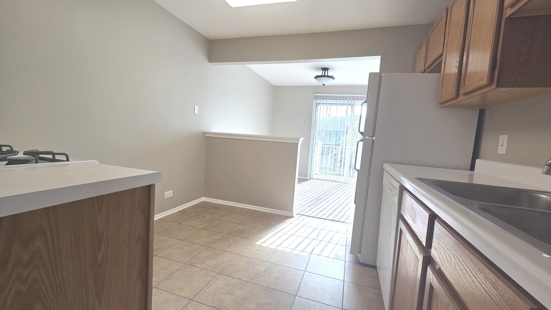 67 Beechmont Court, Unit W2 Schaumburg, IL 60193 - Photo 6 of 15 a view of a kitchen cabinets and a counter place