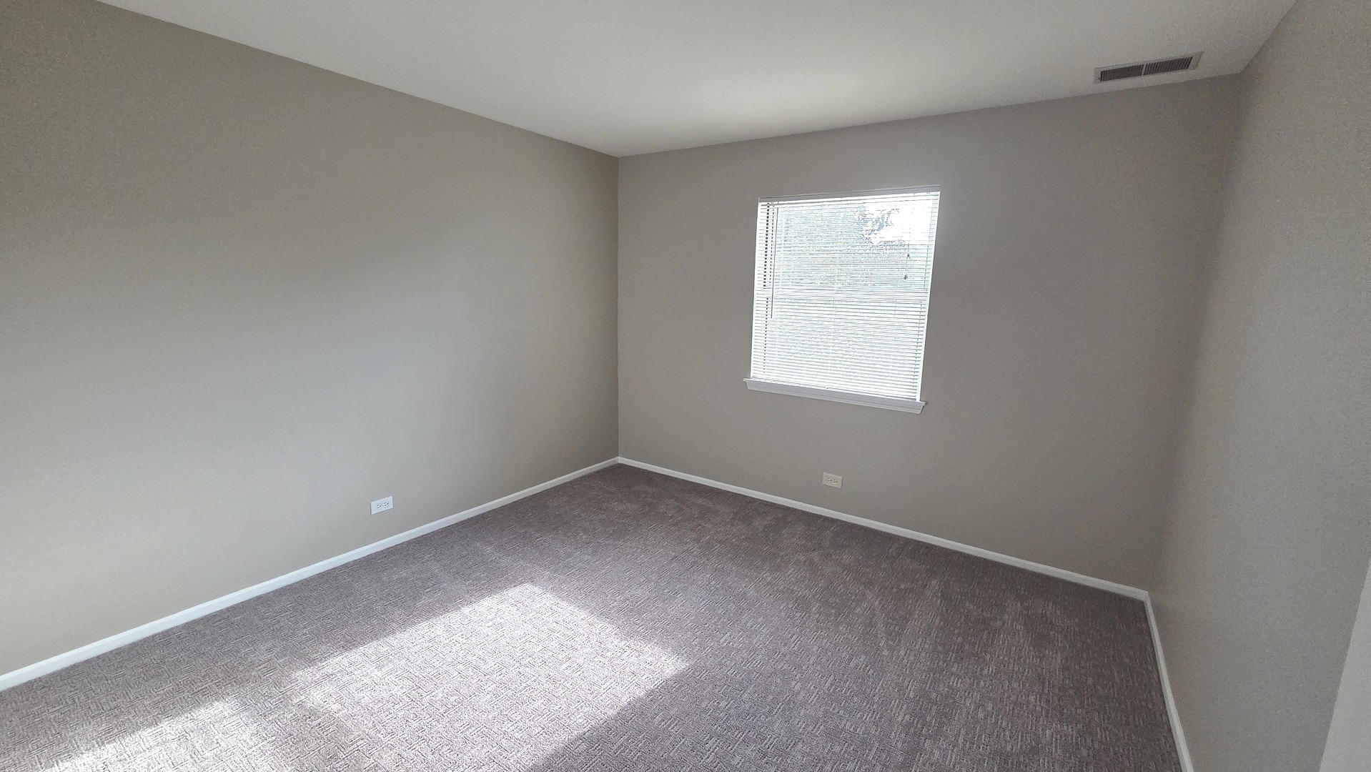 67 Beechmont Court, Unit W2 Schaumburg, IL 60193 - Photo 9 of 15 an empty room with a window