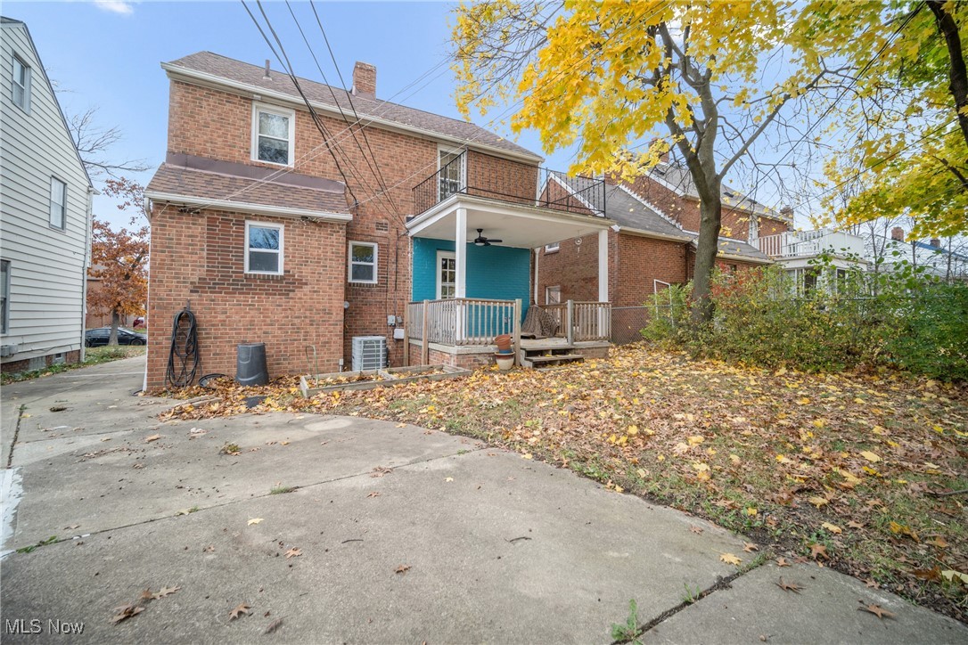 4430 Silsby Road Cleveland, OH 44118 - Photo 4 of 43 Back of property with ceiling fan, a balcony, central AC unit, and a porch