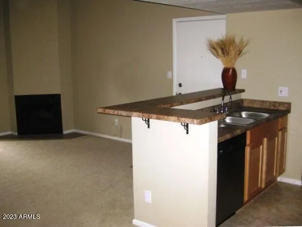 a kitchen with a refrigerator and a sink
