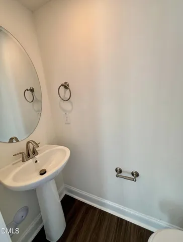 a bathroom with a sink and mirror