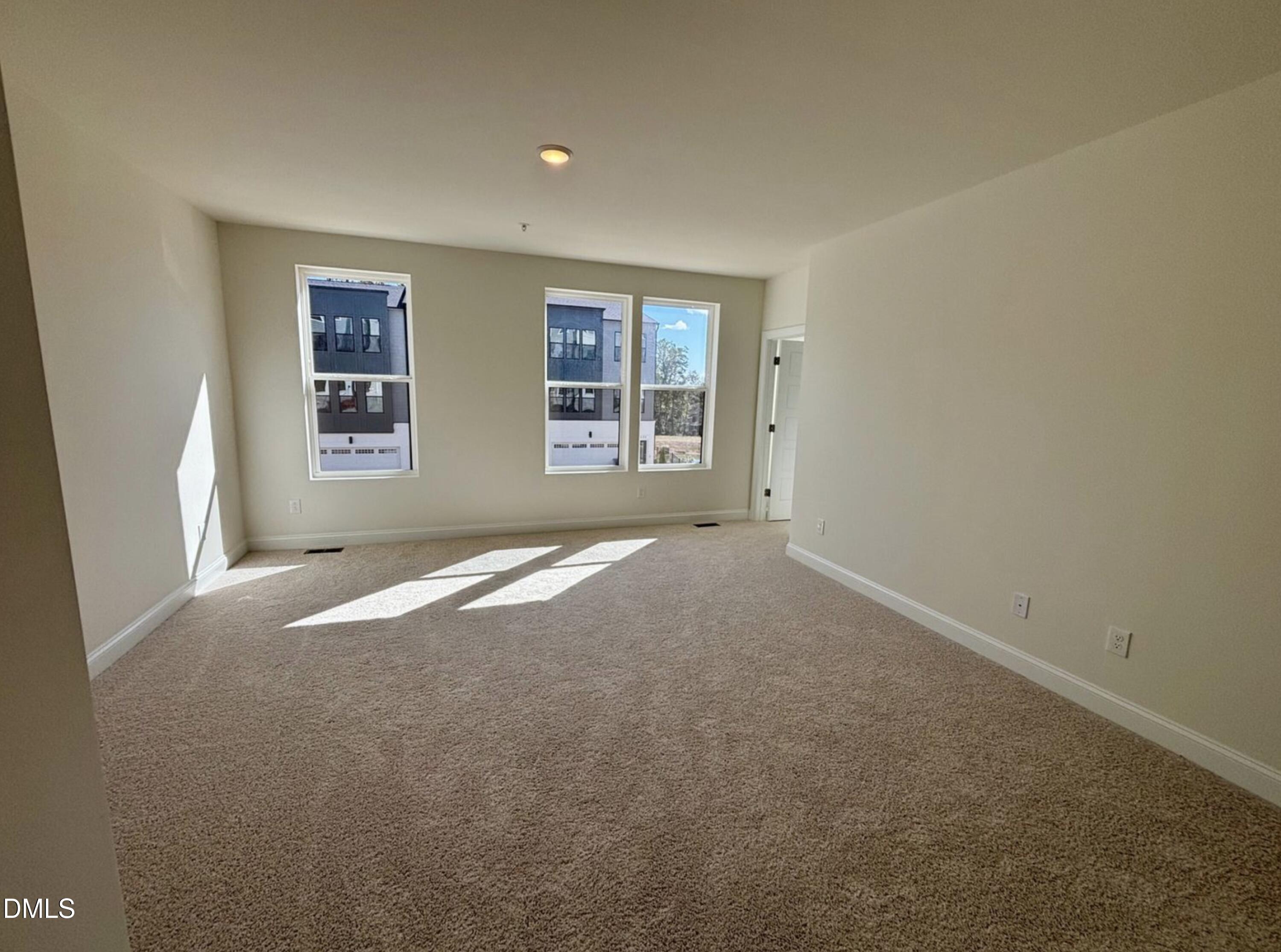 10533 Pleasant Br Drive, Unit 101 Raleigh, NC 27614 - Photo 12 of 27 an empty room with windows