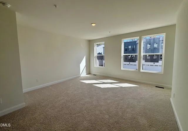 an empty room with a empty space and window