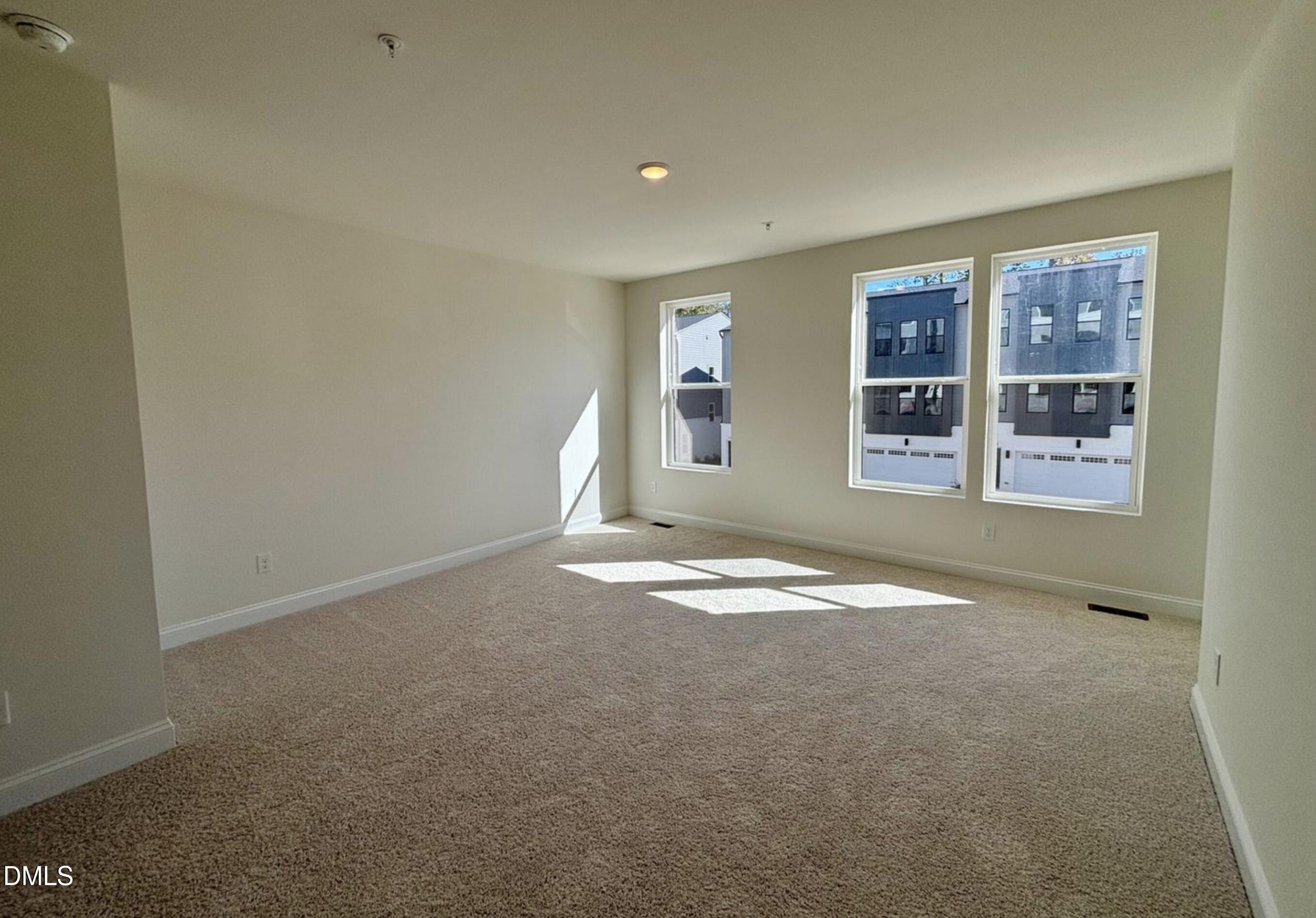 10533 Pleasant Br Drive, Unit 101 Raleigh, NC 27614 - Photo 13 of 27 an empty room with a empty space and window
