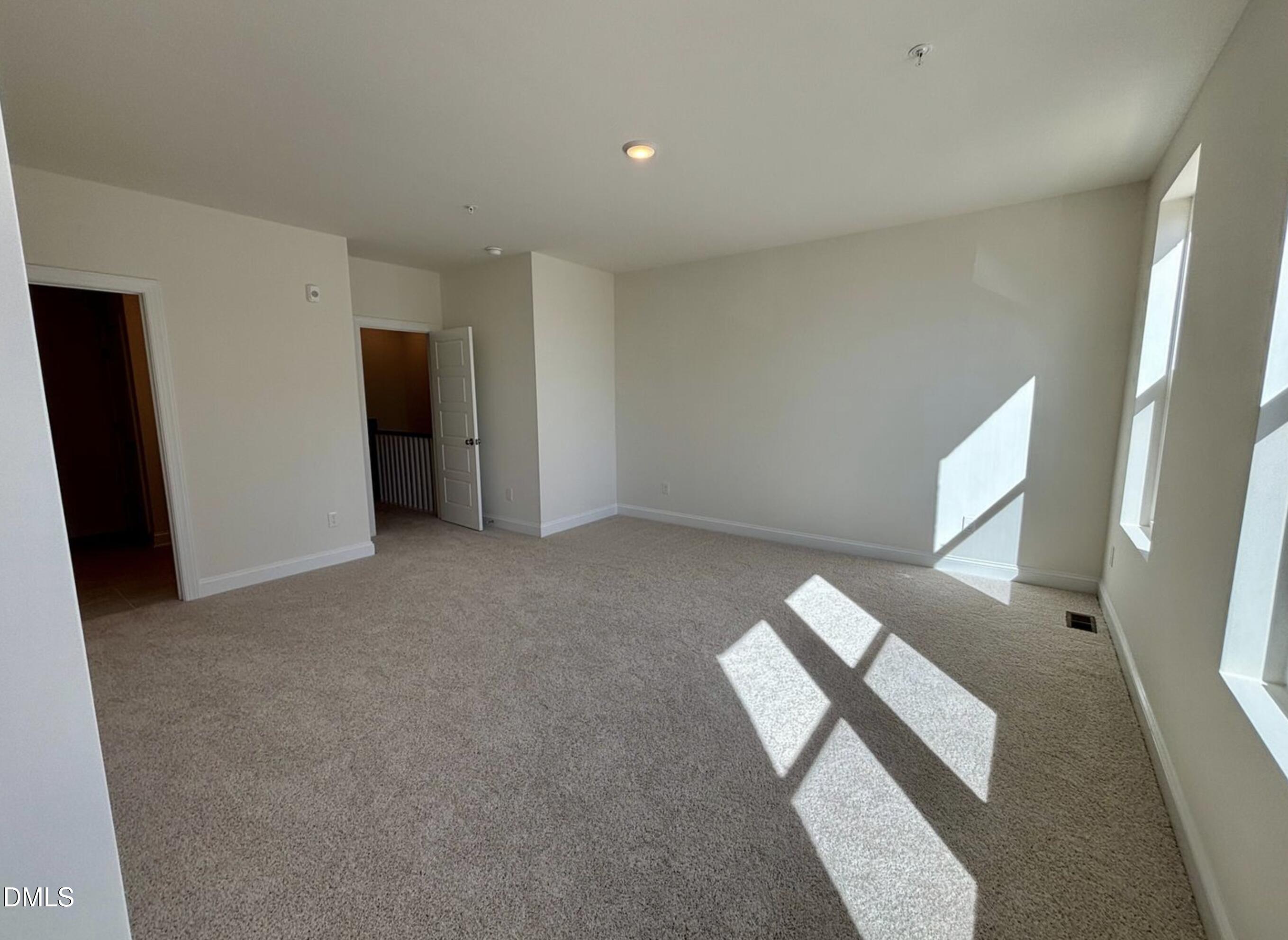 10533 Pleasant Br Drive, Unit 101 Raleigh, NC 27614 - Photo 14 of 27 an empty room with windows