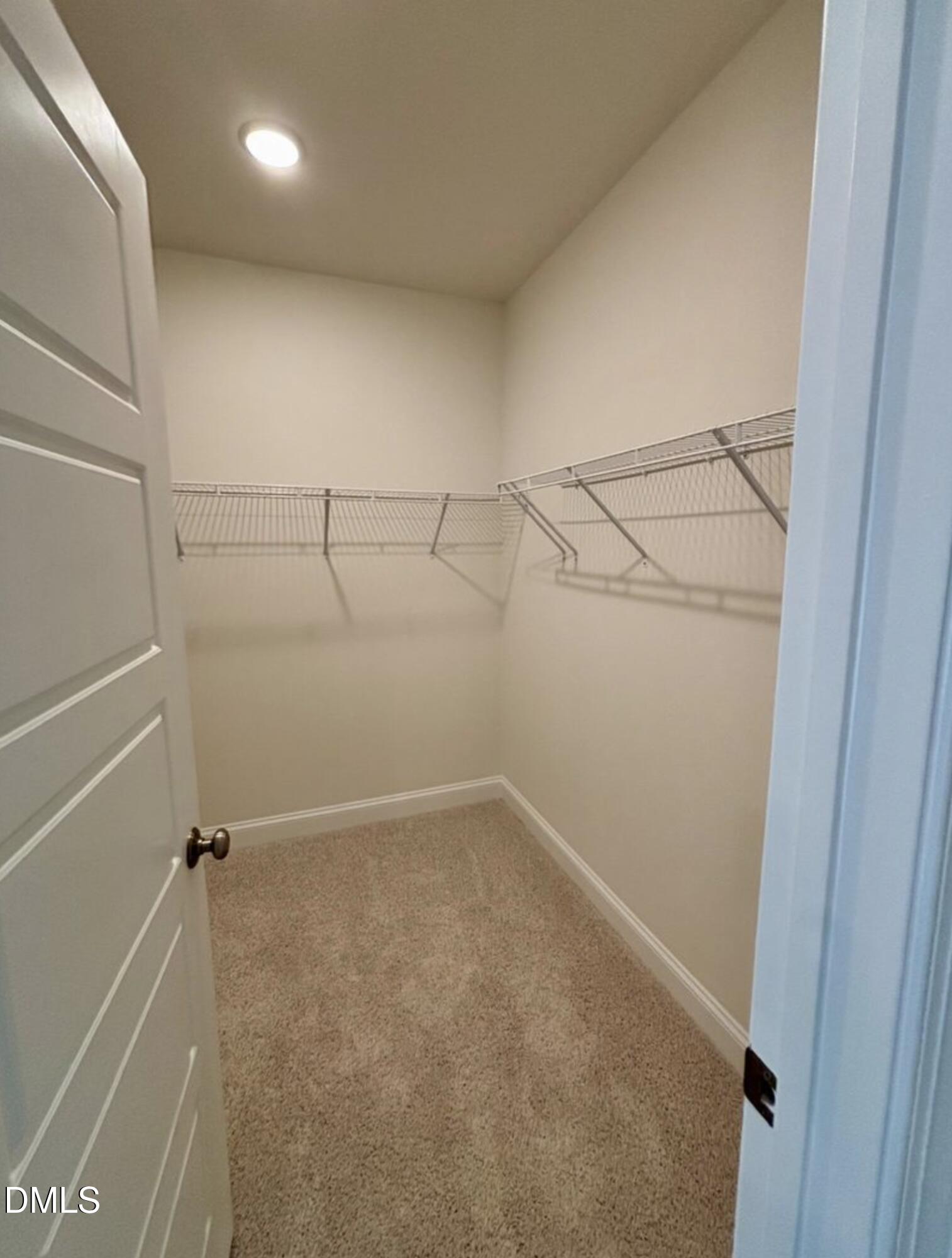 10533 Pleasant Br Drive, Unit 101 Raleigh, NC 27614 - Photo 15 of 27 a view of a room with racks on the wall