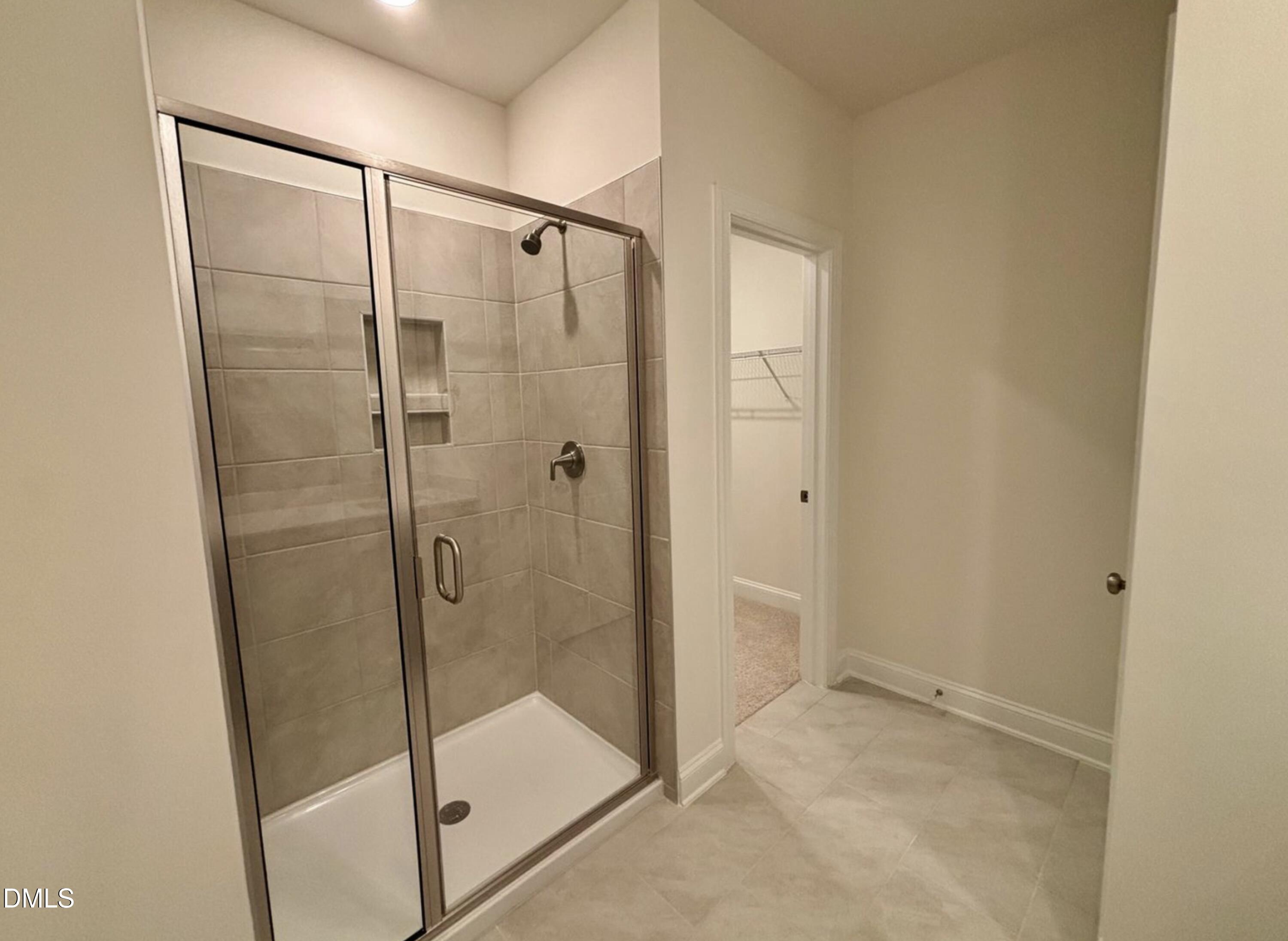 10533 Pleasant Br Drive, Unit 101 Raleigh, NC 27614 - Photo 18 of 27 a bathroom with a glass shower door
