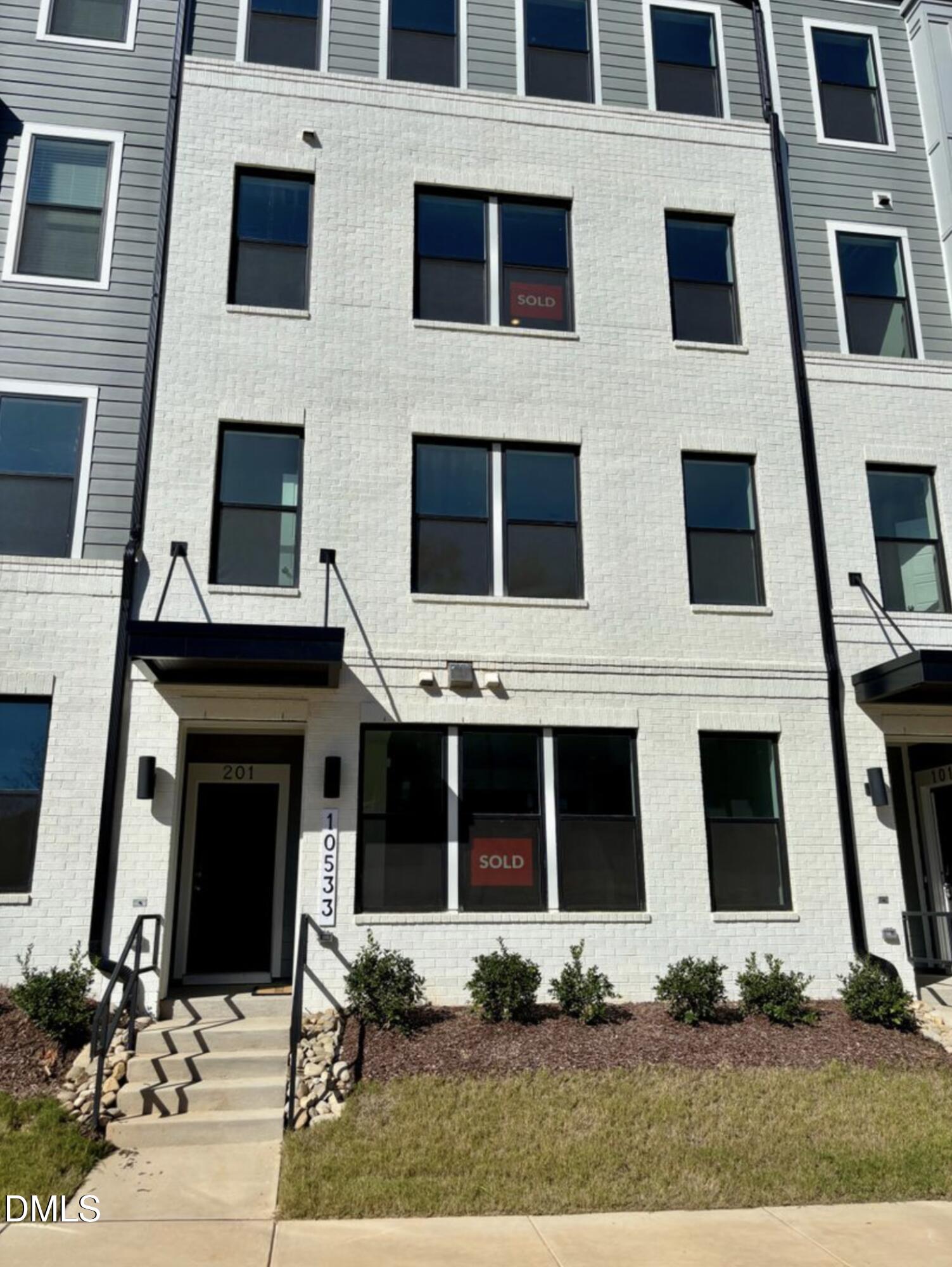 10533 Pleasant Br Drive, Unit 101 Raleigh, NC 27614 - Photo 2 of 27 a building with glass windows