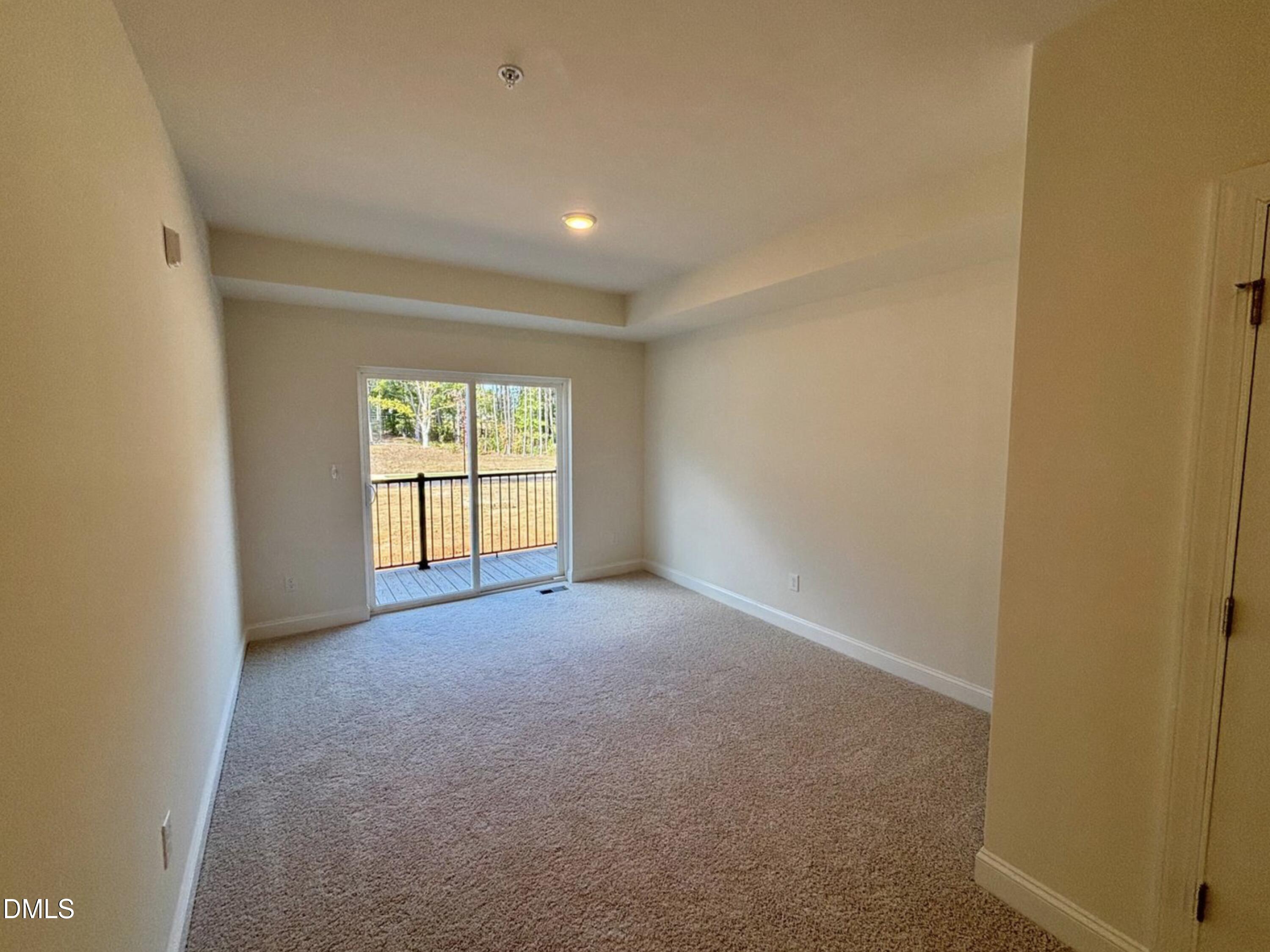 10533 Pleasant Br Drive, Unit 101 Raleigh, NC 27614 - Photo 21 of 27 a view of a big room with windows and chandelier fan