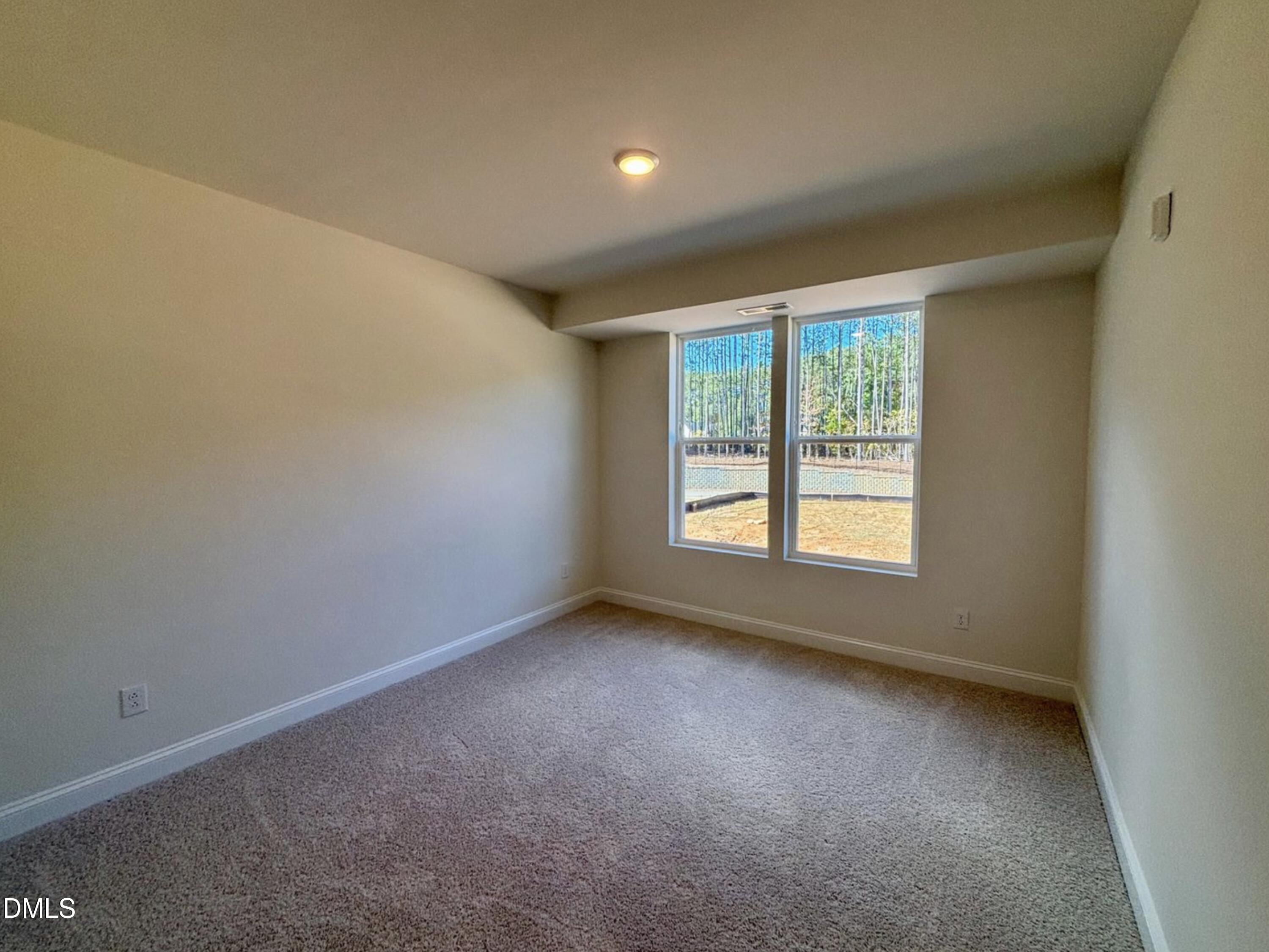 10533 Pleasant Br Drive, Unit 101 Raleigh, NC 27614 - Photo 24 of 27 an empty room with a window