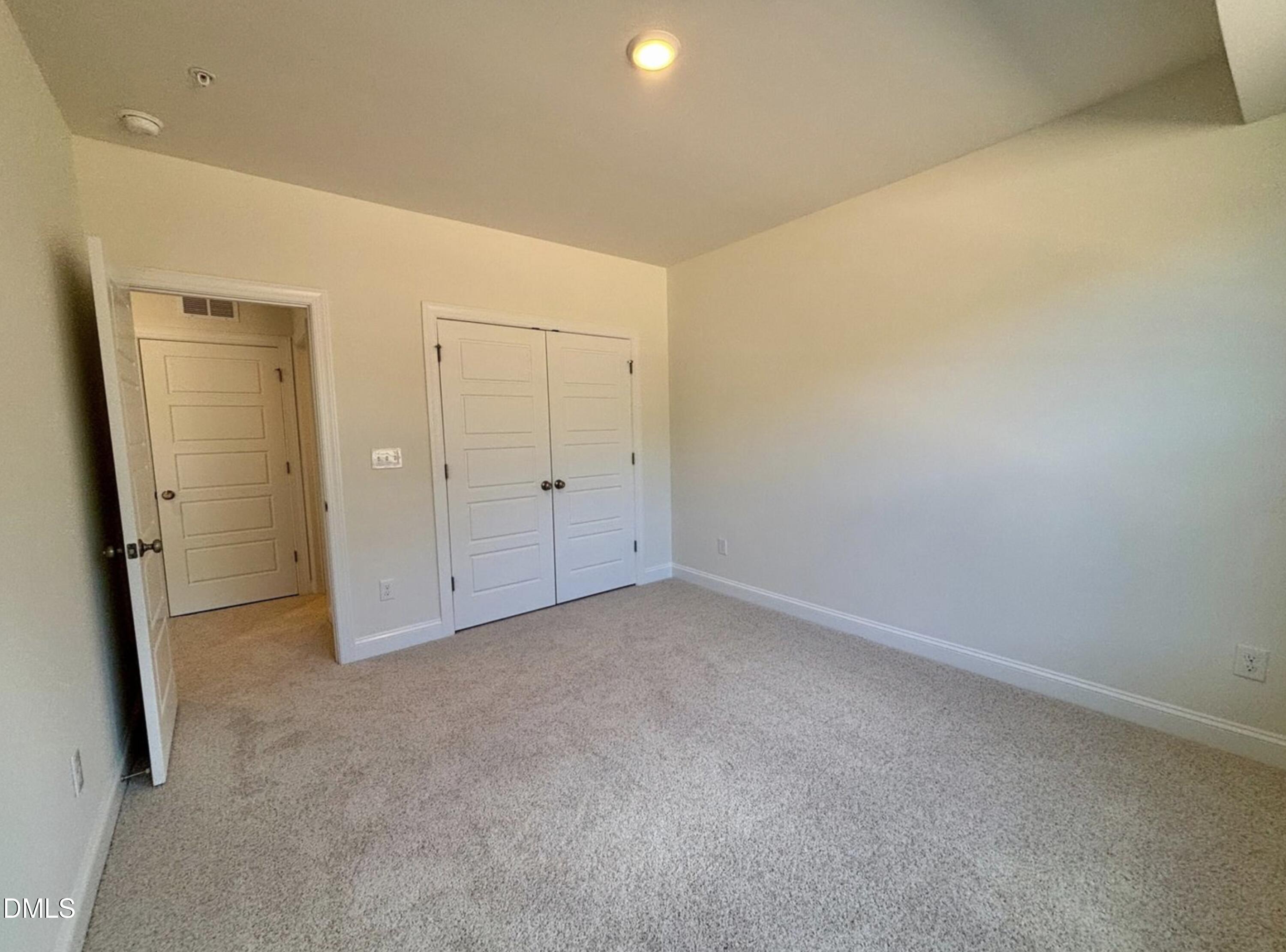 10533 Pleasant Br Drive, Unit 101 Raleigh, NC 27614 - Photo 25 of 27 an empty room with closet