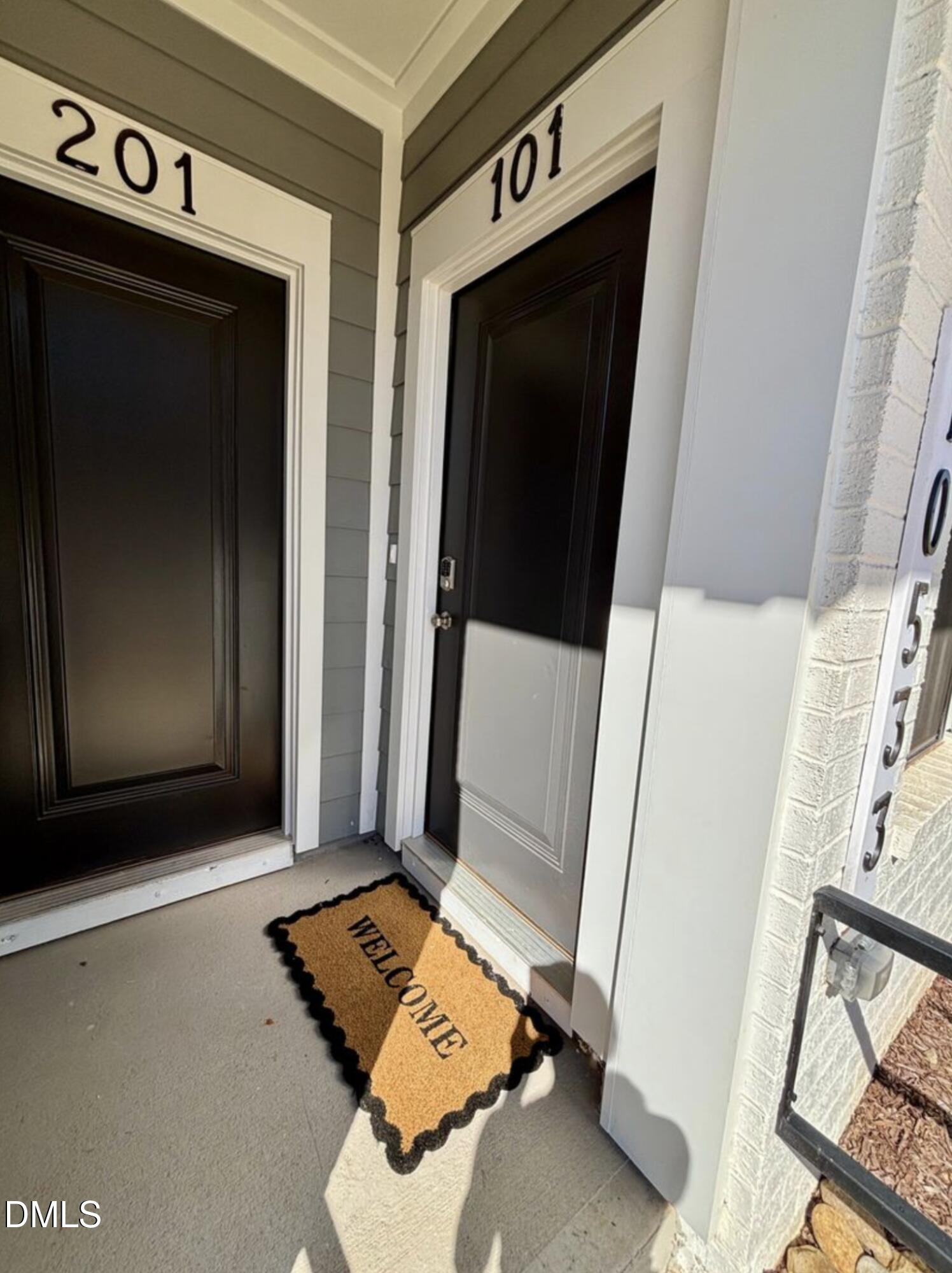 10533 Pleasant Br Drive, Unit 101 Raleigh, NC 27614 - Photo 4 of 27 a view of bedroom with furniture and flat screen tv