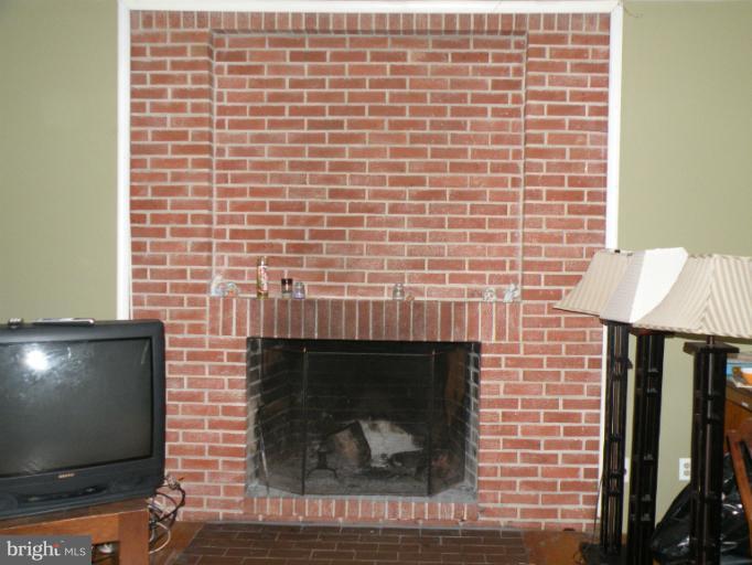 8720 Briarcroft Lane Laurel, MD 20708 - Photo 16 of 30 Living Room Wood Burning Fireplace