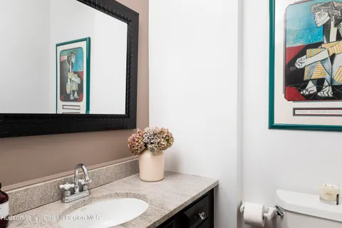 a view of a livingroom with furniture and hardwood floor