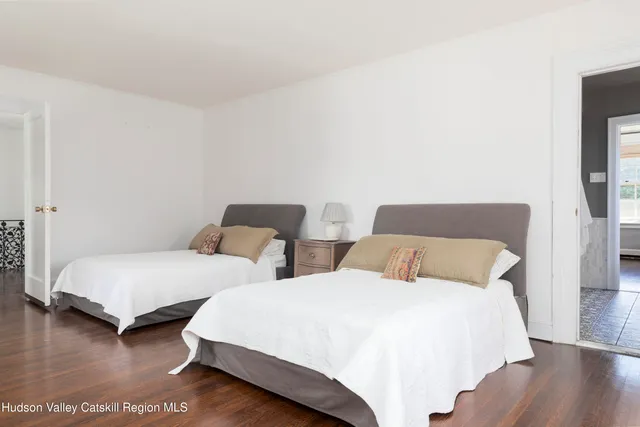 a bedroom with a bed and a table in it