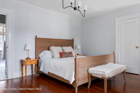 a bedroom with a bed and a table in it