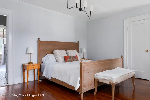 a bedroom with a bed and a table in it