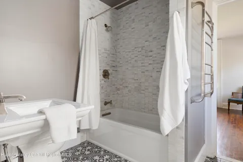 a bathroom with a sink toilet and a tub