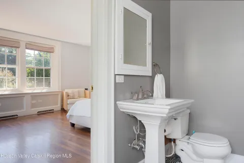 a bedroom with a bed and a table