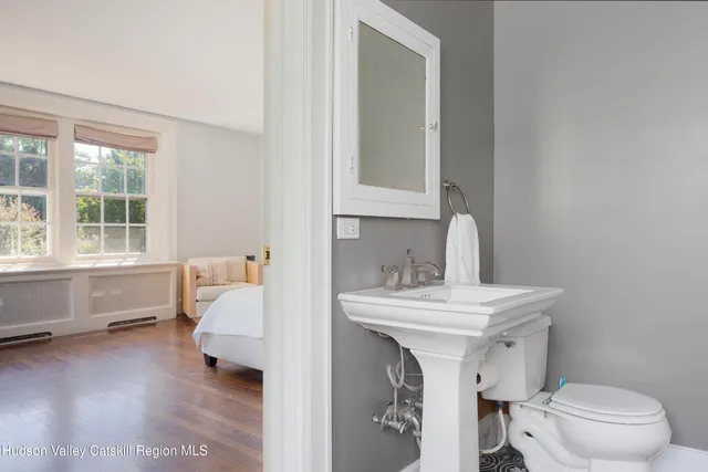 a bedroom with a bed and a table