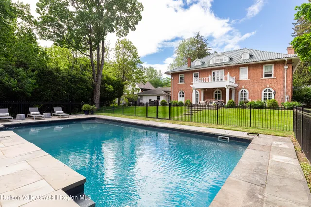 a dining area with furniture and garden view