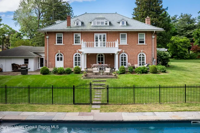 a view of a yard with large trees